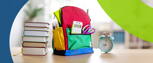 School backpack and books on a table
